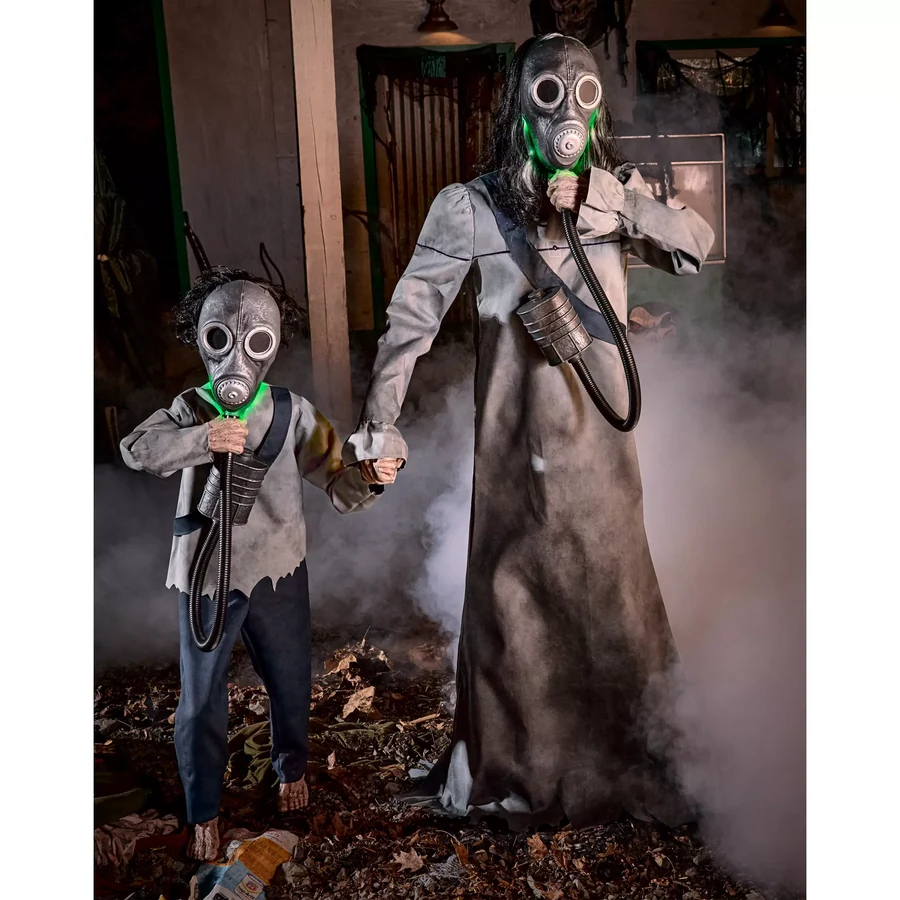 Set up in a dim room with haze drifting past, the green of both masks carrying in the dark
