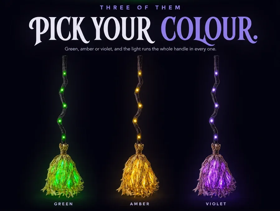 Three of them in a row on a dark background, lit green, amber and violet