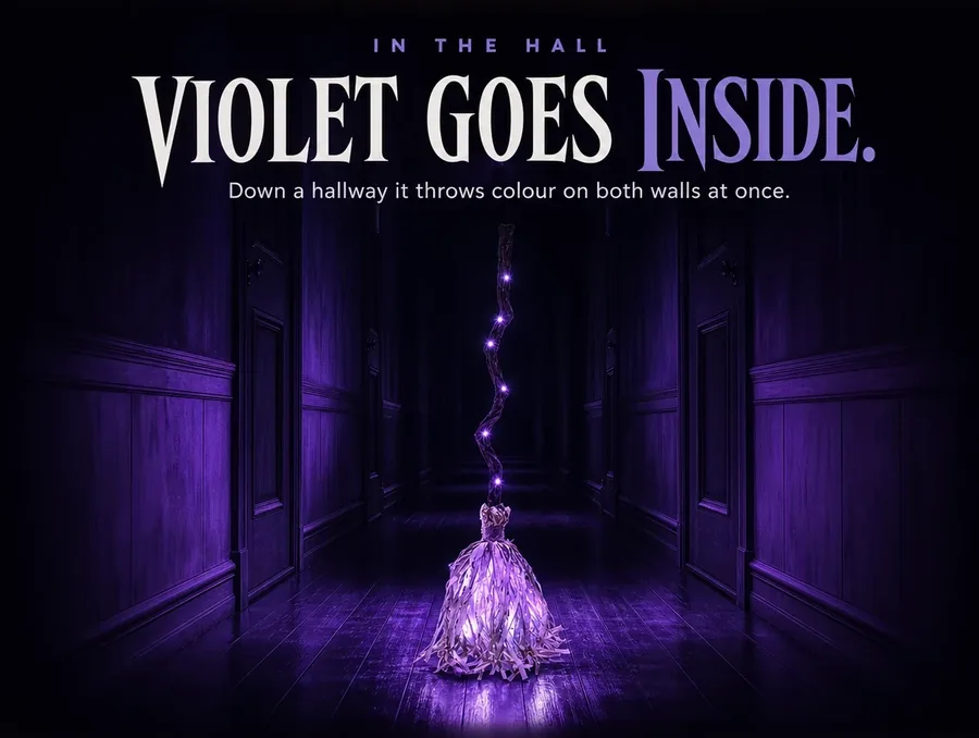 Lit violet in a long dark hardwood hallway, the colour stretching down the boards