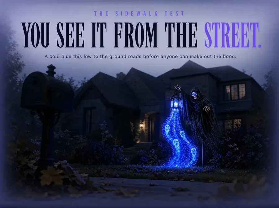The stake seen small from the public sidewalk, its blue the only cold light on the street