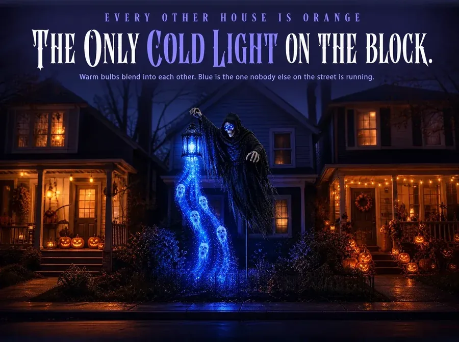 Three yards side by side at night, two glowing warm amber and the middle one cold blue